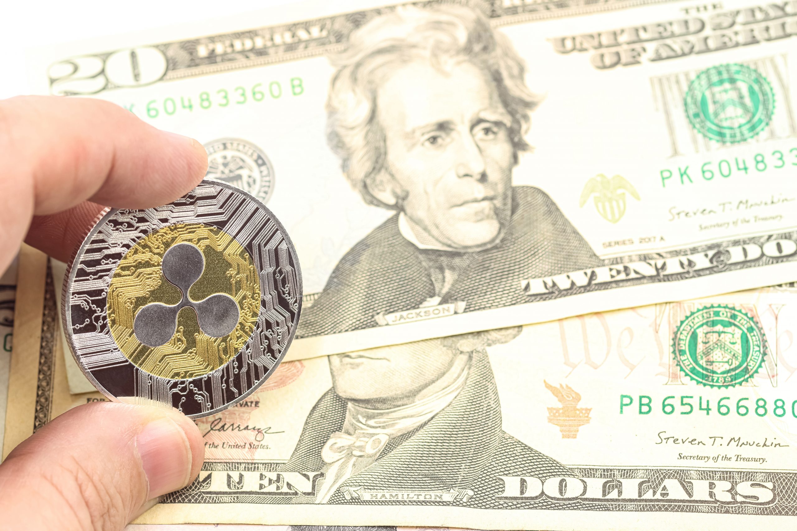 Hand showing a Ripple XRP cryptocurrency.